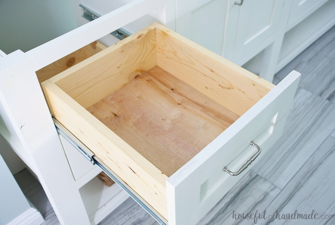 Large bathroom vanity drawer pulled out to reveal the drawer box. 