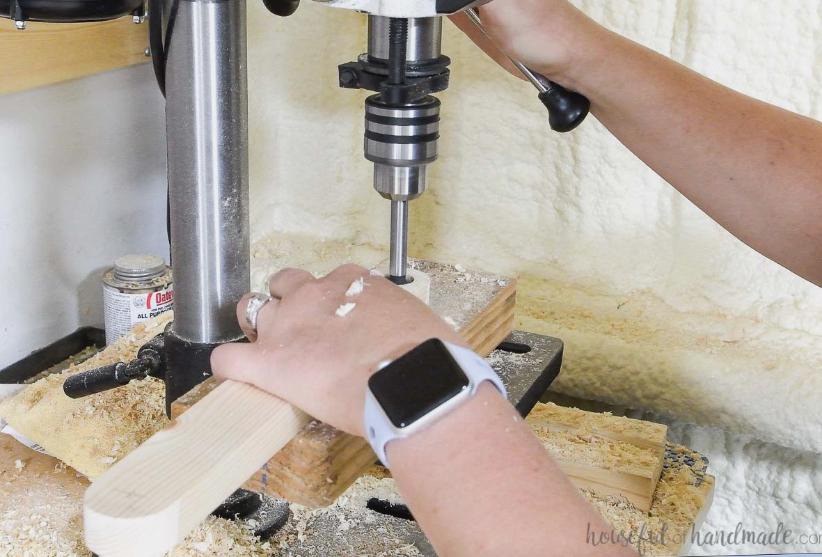Drilling holes with a forstner bit into the curved 1x2 boards.