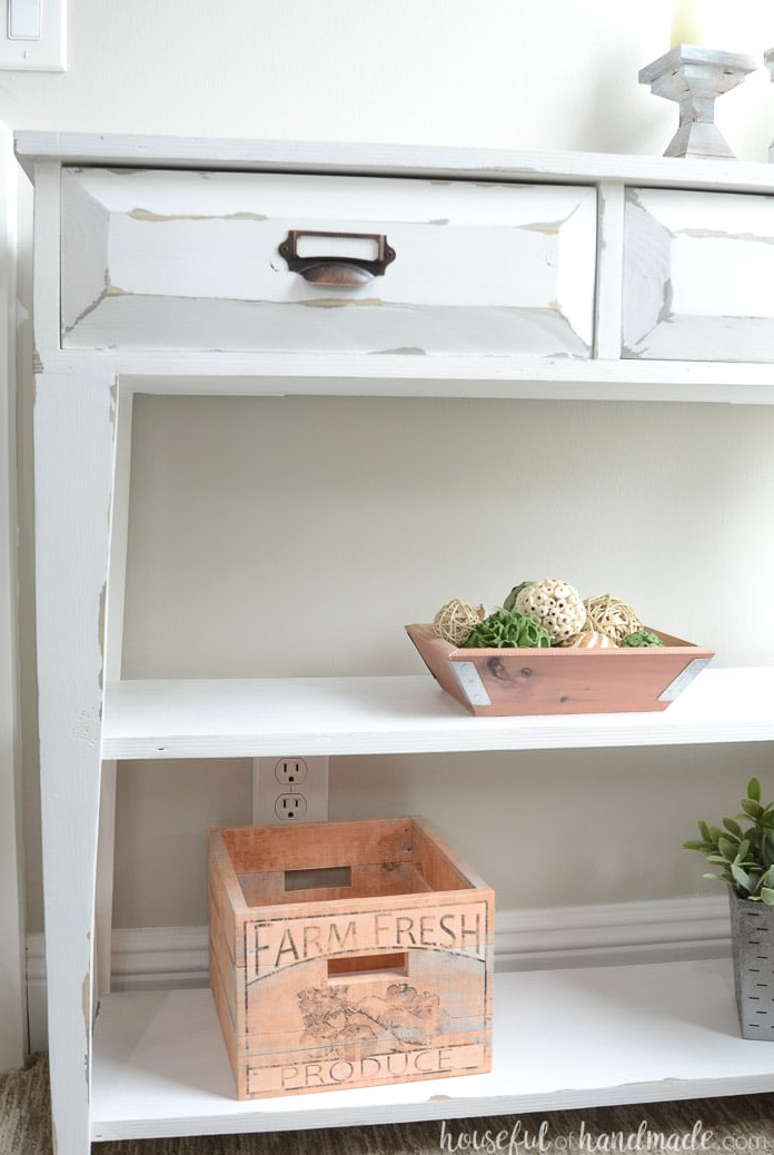 The tampered legs and open shelves give this small console table lots of farmhouse style. Housefulofhandmade.com