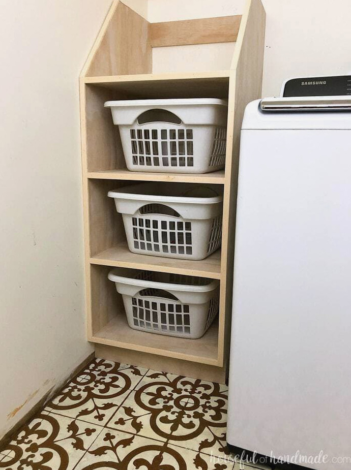 Stackable laundry basket storage with three shelves.