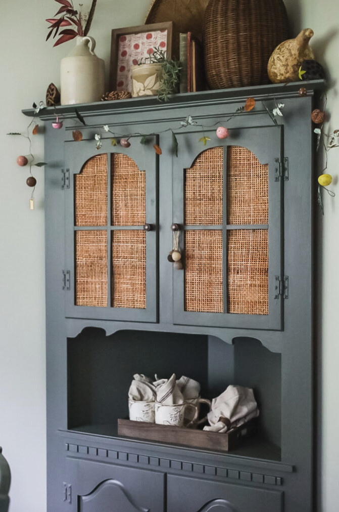 green corner hutch with fall decor