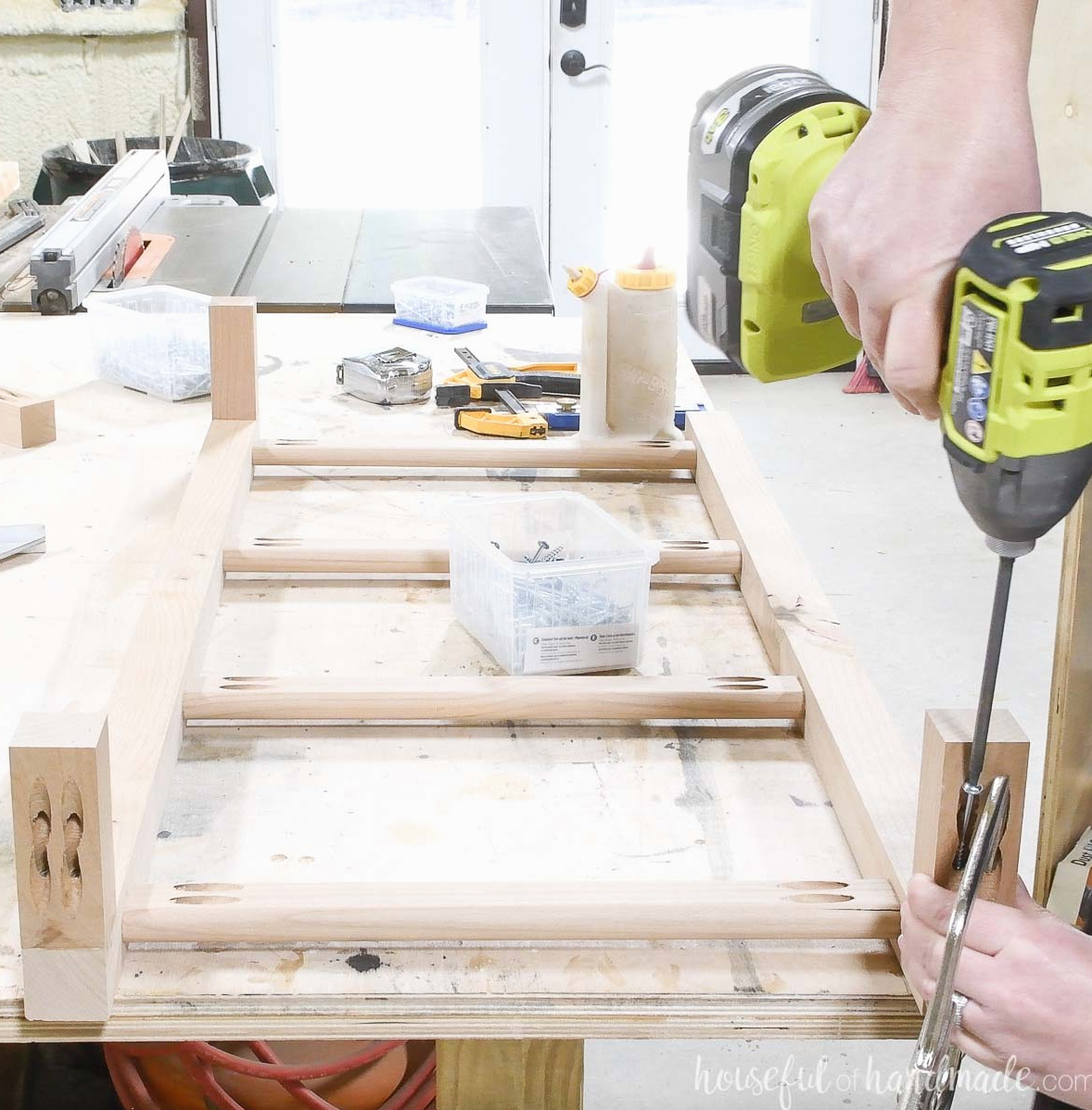 Fastening the 2x2 pieces that hold the blanket ladder away from the wall. 