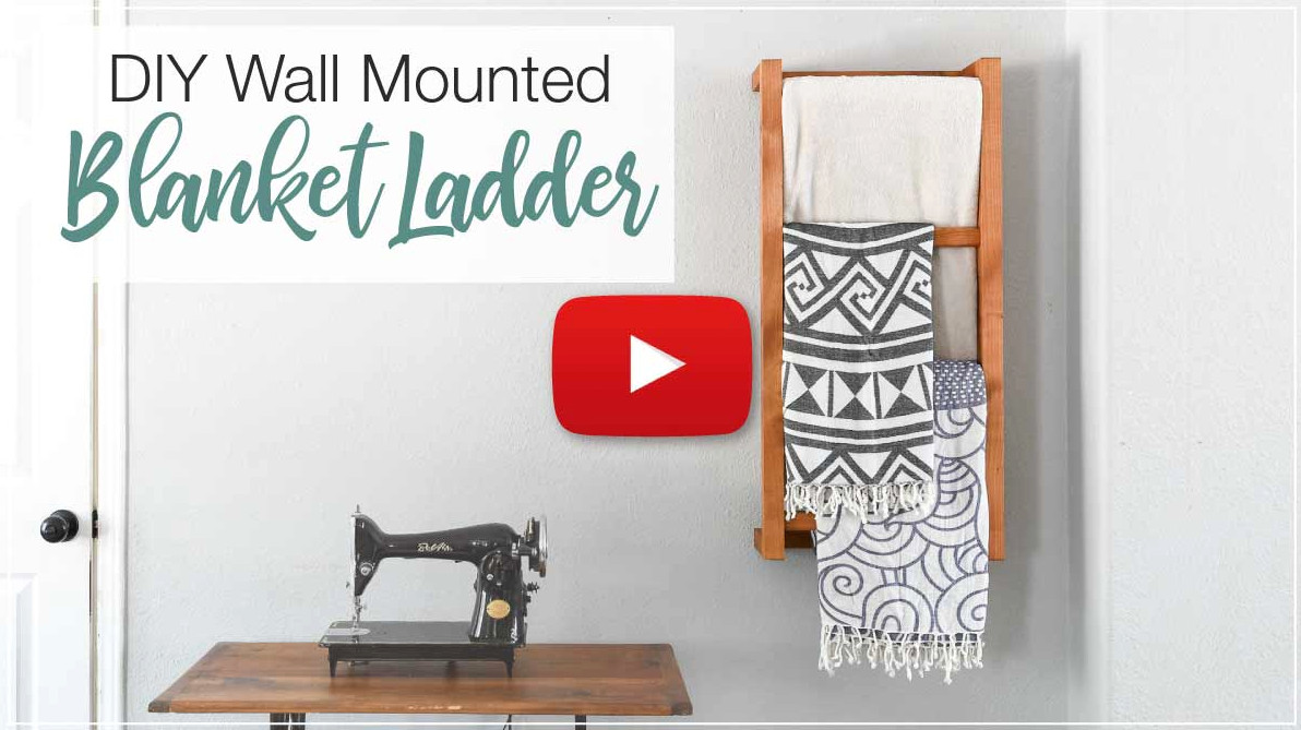 YouTube thumbnail featuring a play button for the DIY Wall-Mounted Blanket Ladder video.