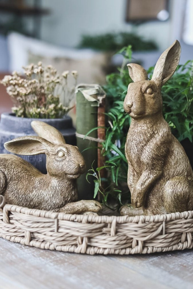 gold bunny statues in tray