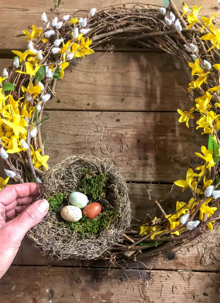 making a wreath with forsythia and a bird nest