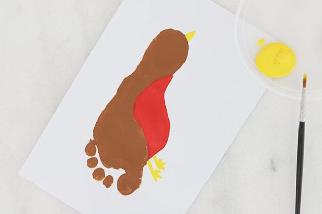 Adding paint to feet and beak