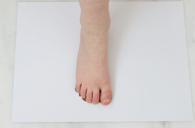 Pressing footprint onto paper