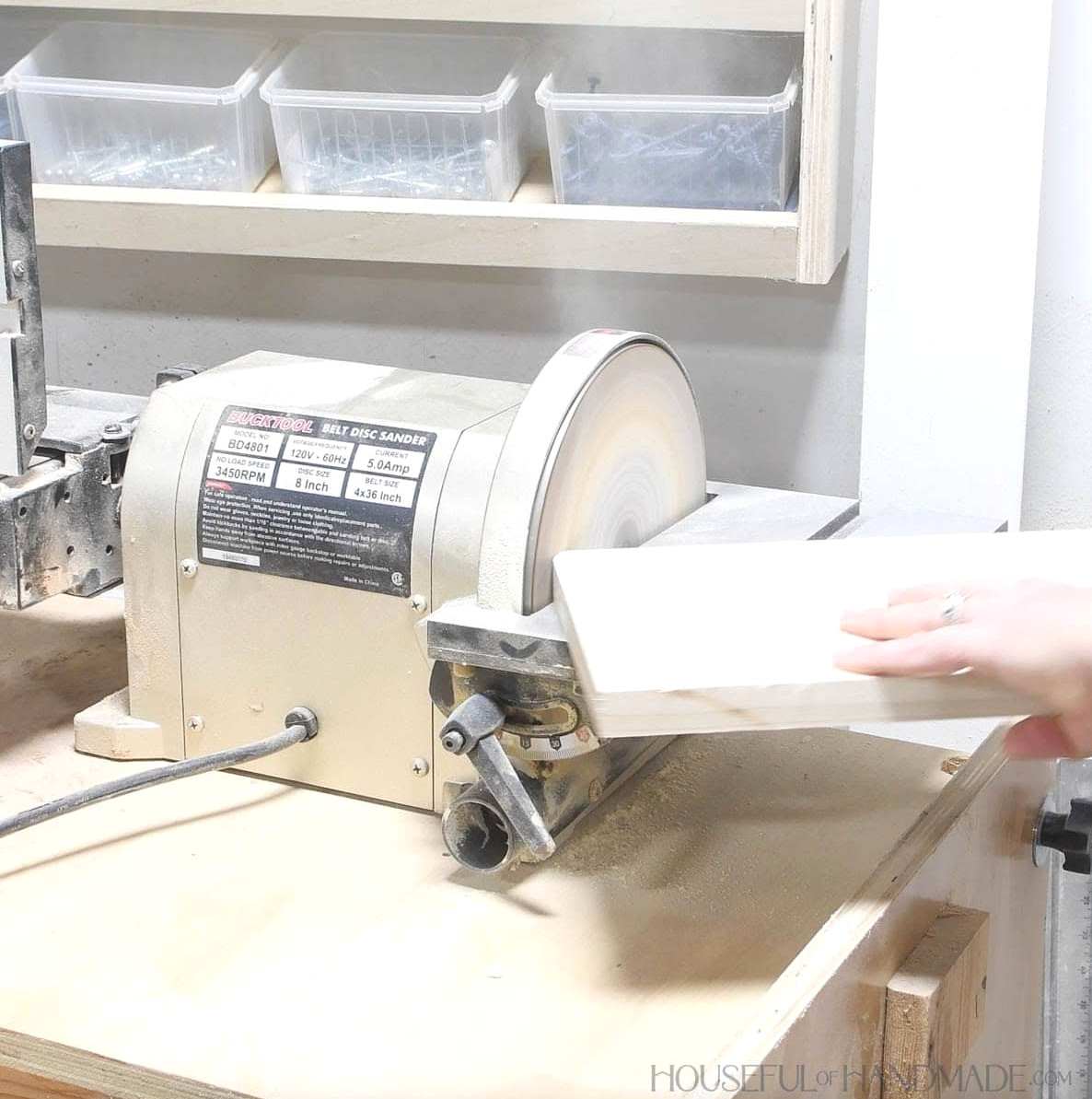 Sanding a curve in the top corner of the board.