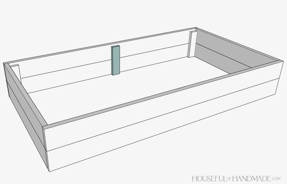 Adding a center support piece to a bed with two boards on top of each other. 
