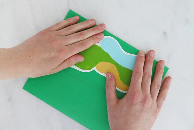 Folding green cardstock in half