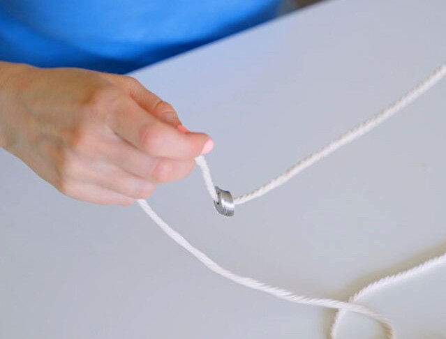 Attach washers to cotton cord