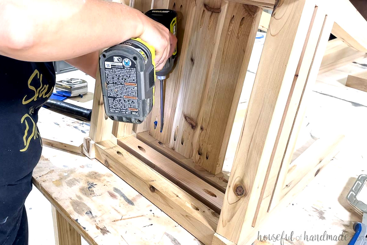 Attaching the shelf boards to the base with pocket holes.