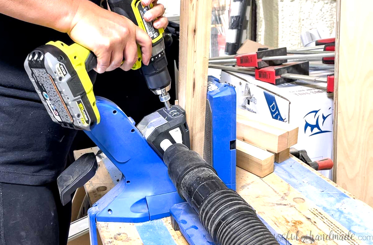 Using a Kreg jig to drill pocket holes in the boards.