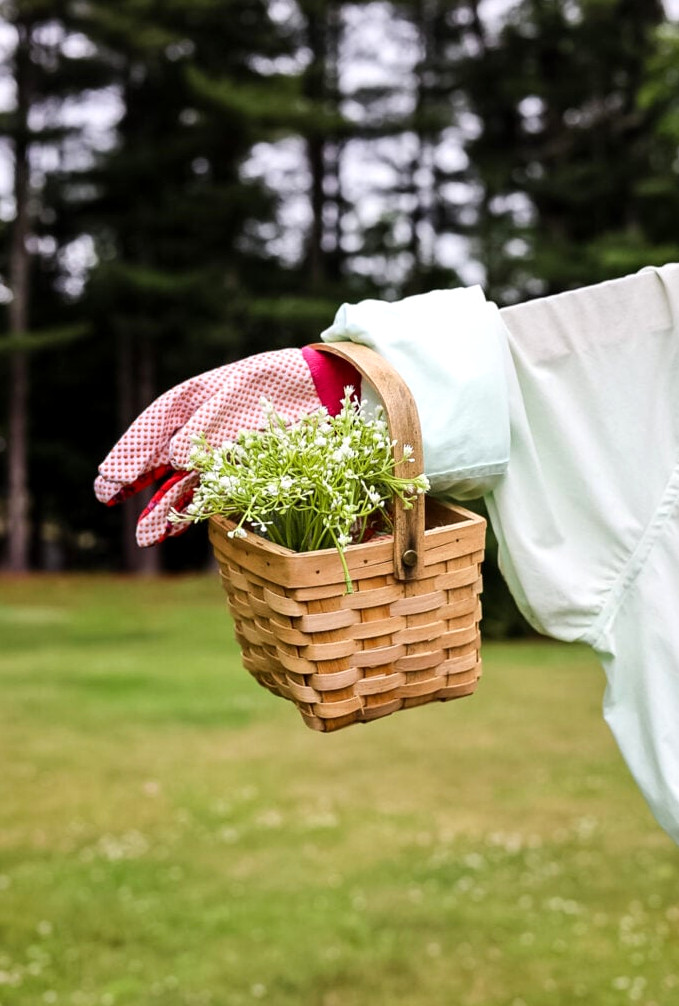 small wicker basket on scarecrow