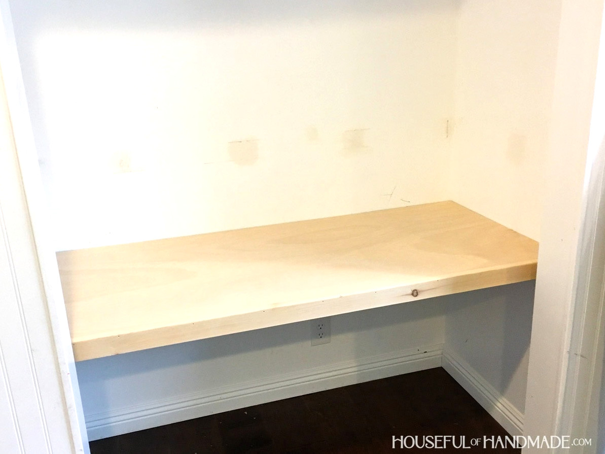 Desk top built inside closet prior to staining and painting walls.