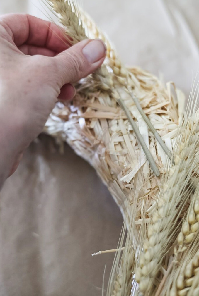 making a wreath with dried wheat