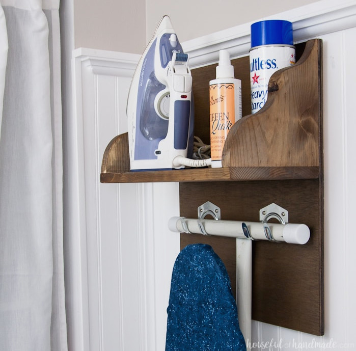 Try these fantastic DIY projects to arrange your home this year. Make the ideal storage spot for your iron and supplies. This simple DIY iron rack with ironing board storage is a fast project that helps keep a laundry or craft room tidy. Free building instructions on Housefulofhandmade.com | Laundry Room Storage Ideas | Ironing Board Hanger | Iron Shelf | Things to Build with Scraps | $100 Room Challenge