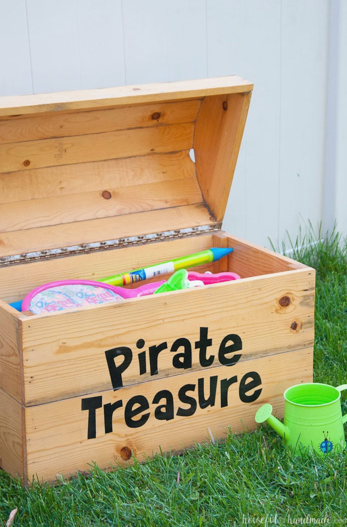 Create excellent outdoor toy storage with this DIY treasure chest toy box. It holds plenty of toys and has an amazing look. Free building instructions from Housefulofhandmade.com | Silhouette Creator's Challenge | Woodworking Plans | Pirate Treasure Chest | How to Build a Treasure Chest | Outdoor Storage Ideas | Toy Storage Ideas