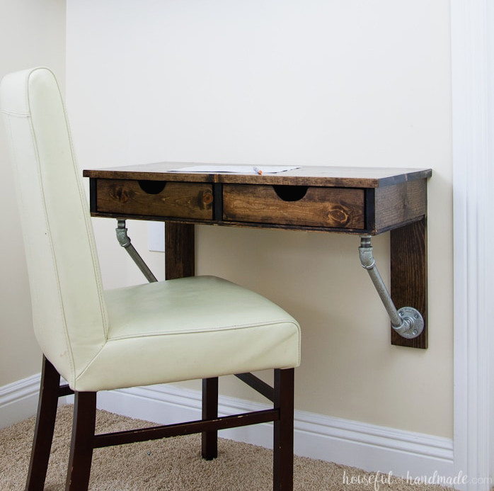 Try these incredible DIY projects to organize your home this year. Build an ideal homework area with this simple-to-make desk. This rustic industrial wall-mounted desk is easy to construct and fits into any small space. Download the free construction plans today! | Housefulofhandmade.com