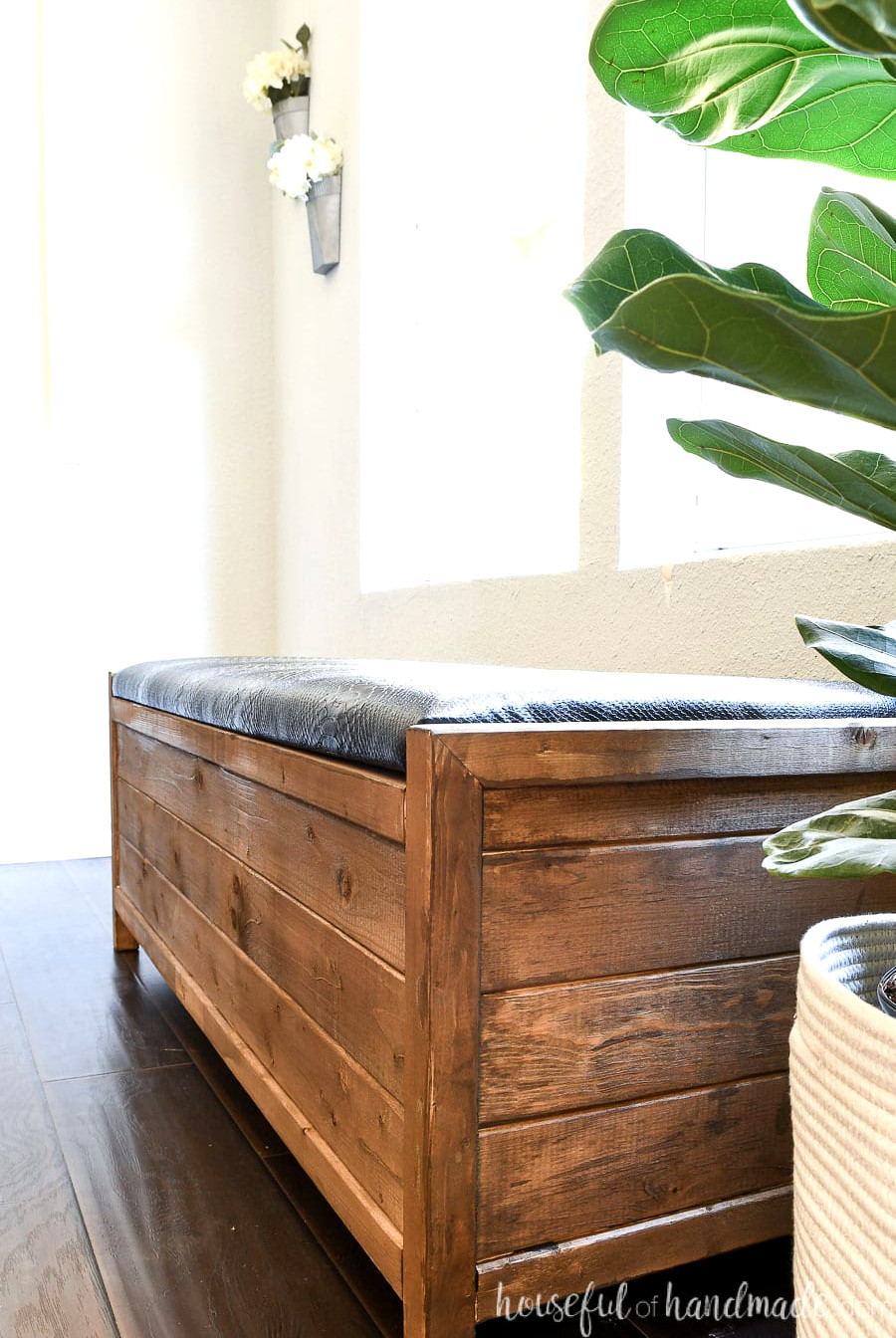 Close-up view of the side profile of the DIY upholstered storage bench.