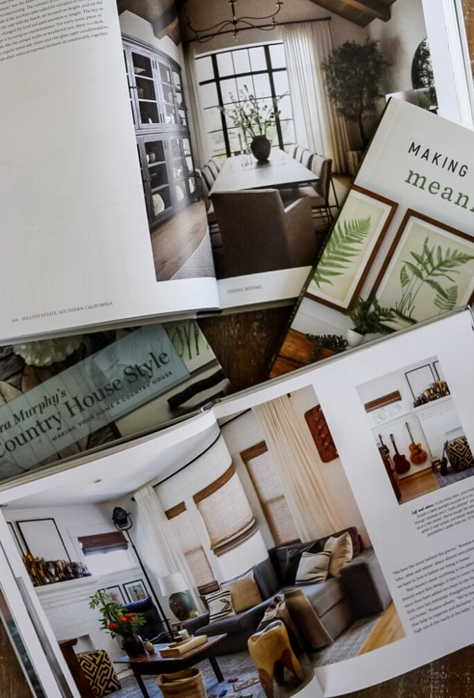 4 home decor books on a table with open pages