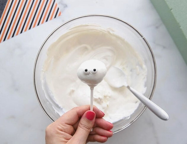 Attach two candy eyes