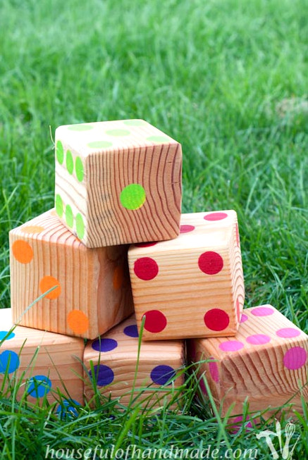 Create colorful yard dice to bring along to your next gathering. Tutorial on Houseful of Handmade.