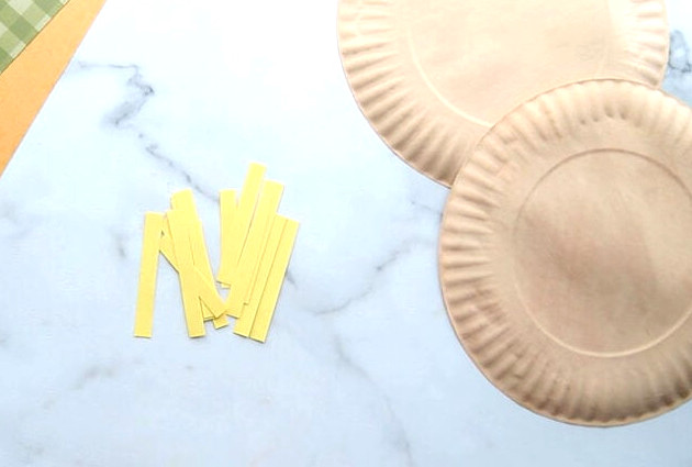 Snip yellow paper into strips
