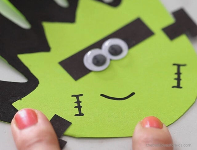 Draw Frankenstein's smile with a black marker