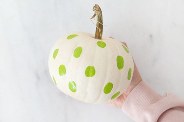 Green witch dots all over pumpkin