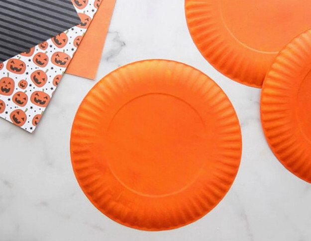 Paint paper plates orange
