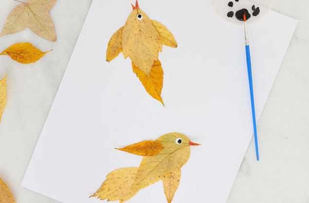 Painting eye features on a leaf bird