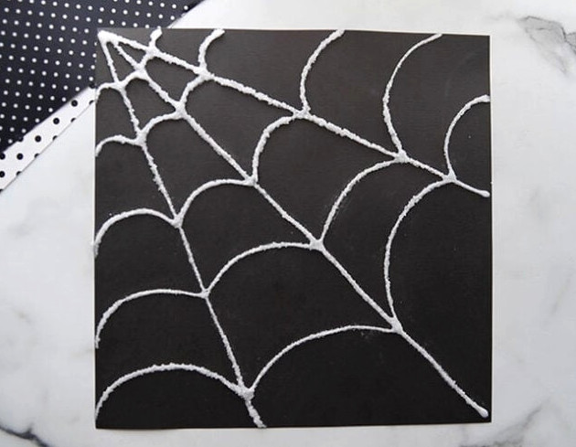 Shake off salt from spider web