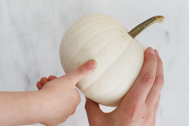 Adding green Frankenstein spots to pumpkin with a stamp