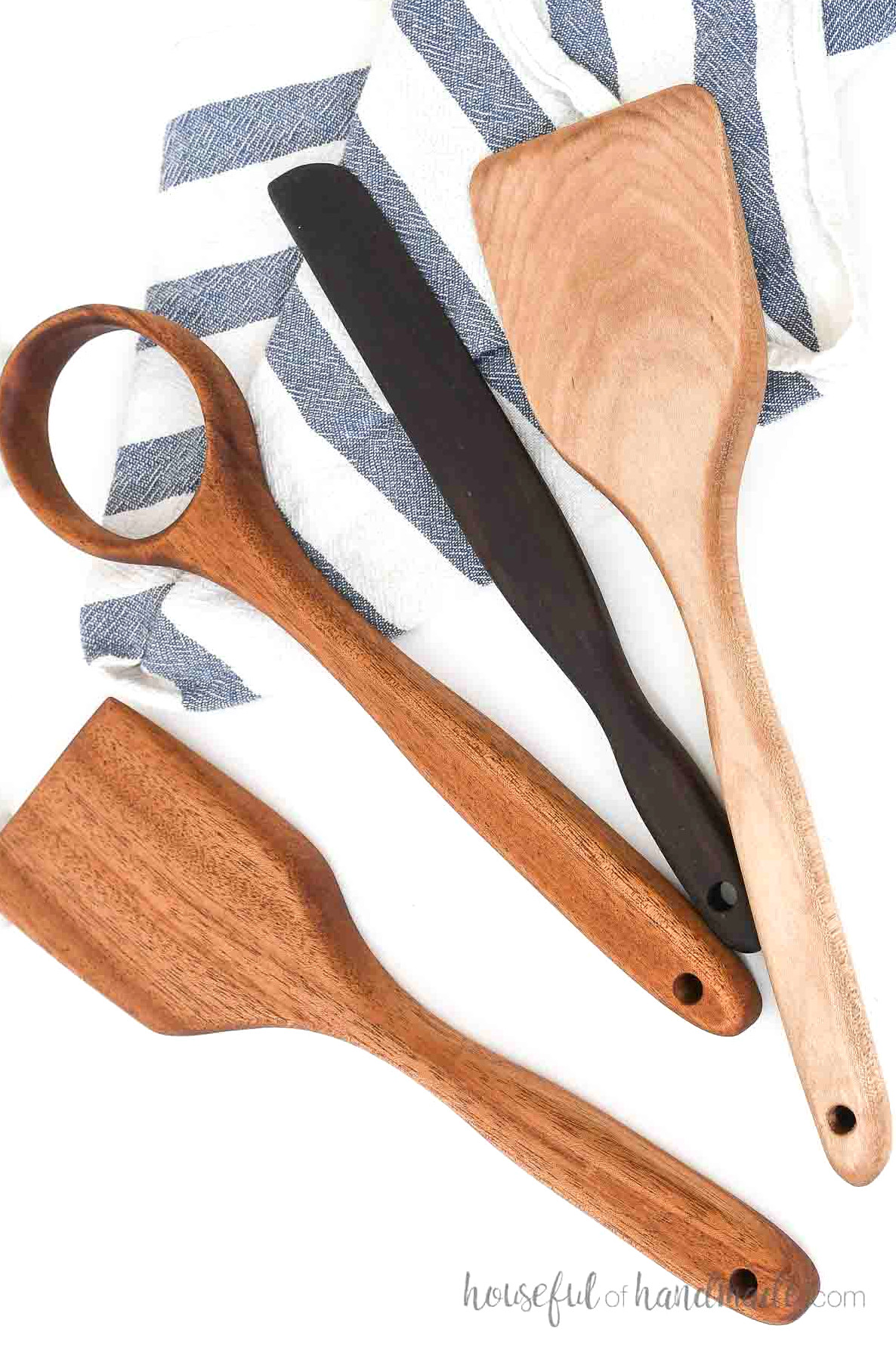Two spatulas, a whisk, and a scraper made from scraps of hardwood.