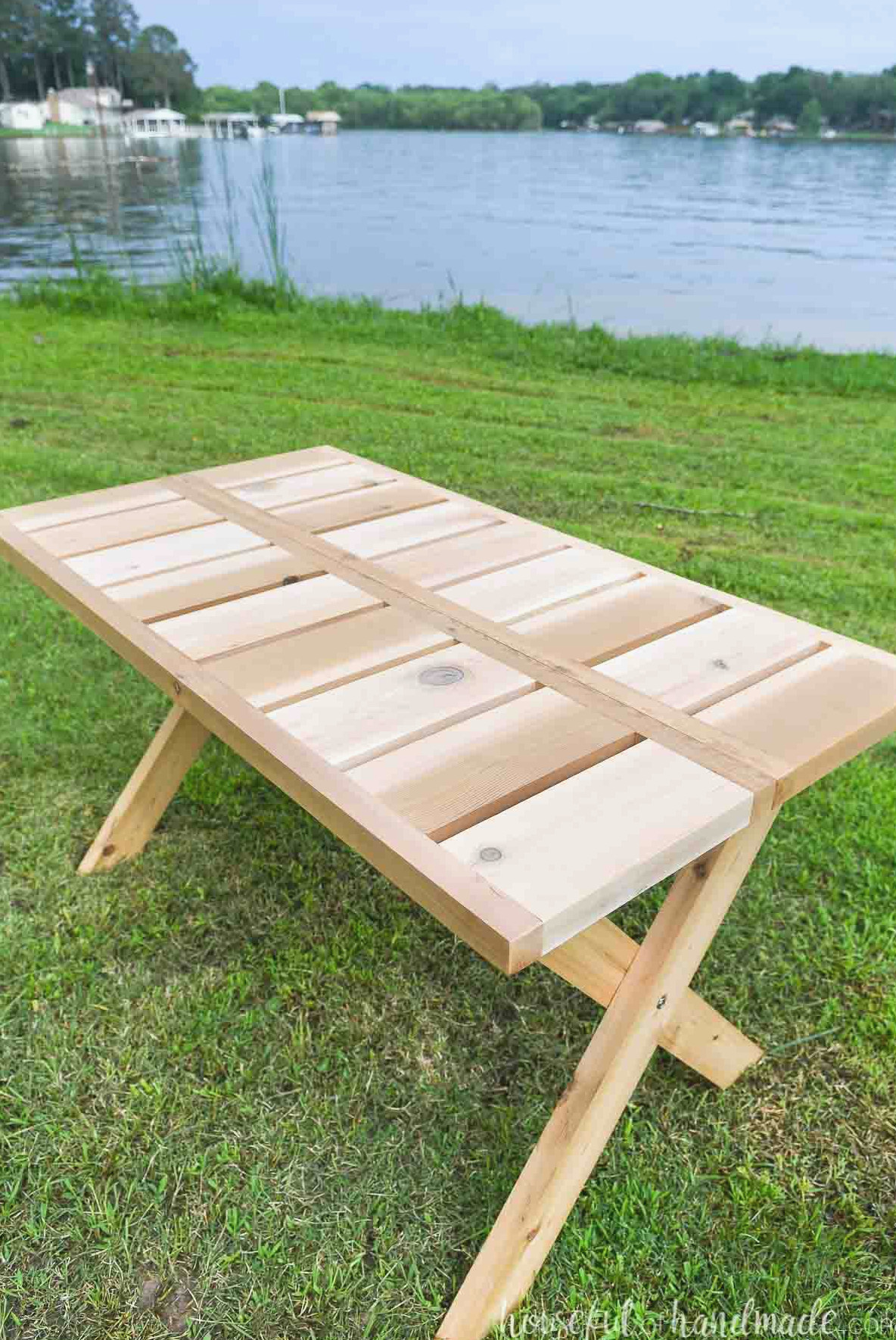 Looking at the top of the wooden folding picnic table made from cedar 2x6 and 2x2 boards.