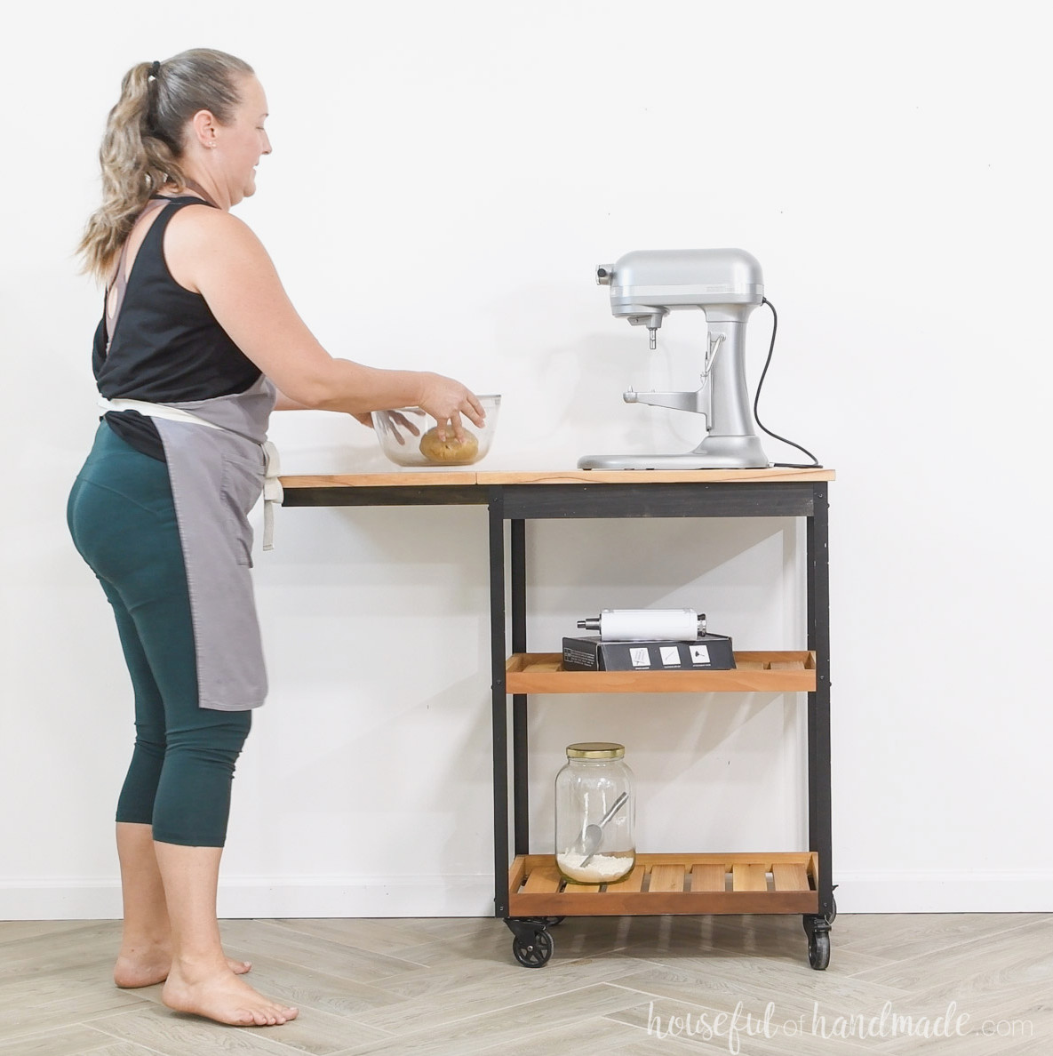 Kati using the kitchen cart with the leaf raised.