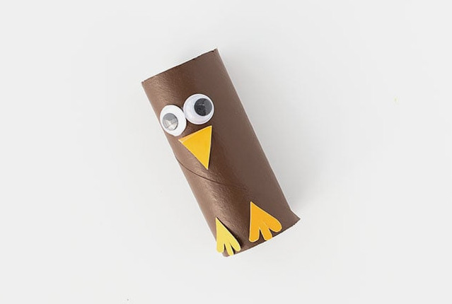 Attach the beak and feet to the turkey roll