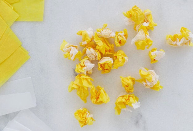 Scrunch the tissue paper into balls