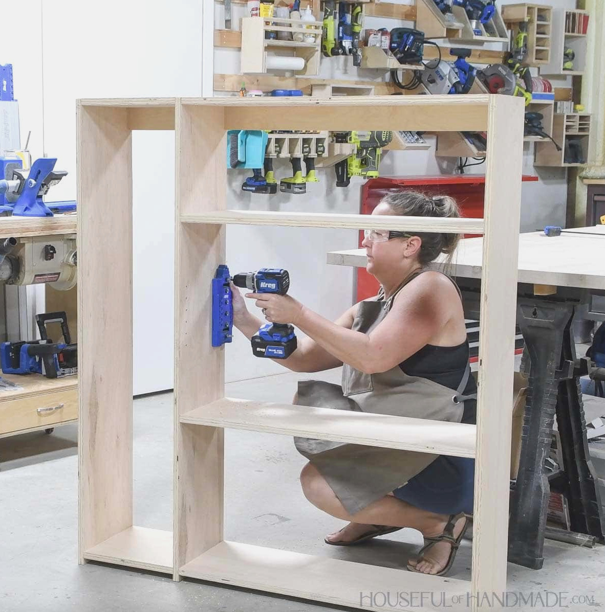 Making shelf pin holes with a jig. 