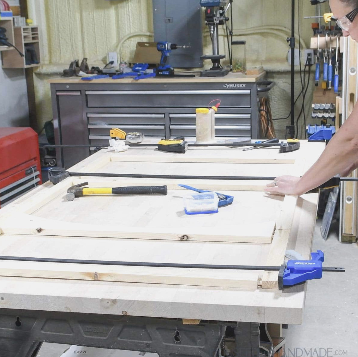 Attaching the second side of the face frame and clamping it securely. 
