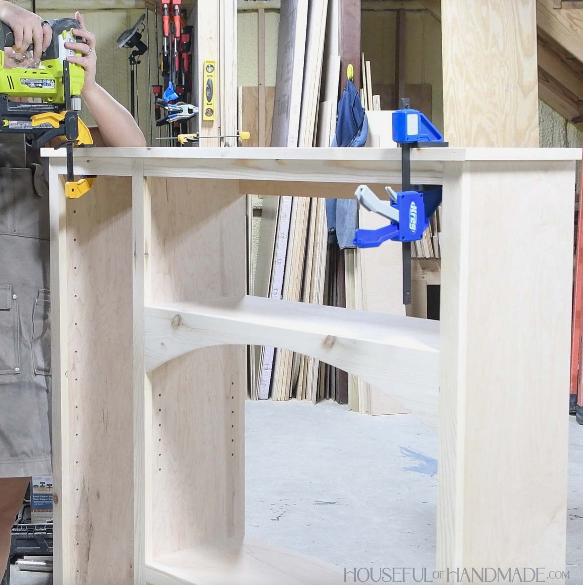 Fastening 1x2 trim to the cabinet top. 