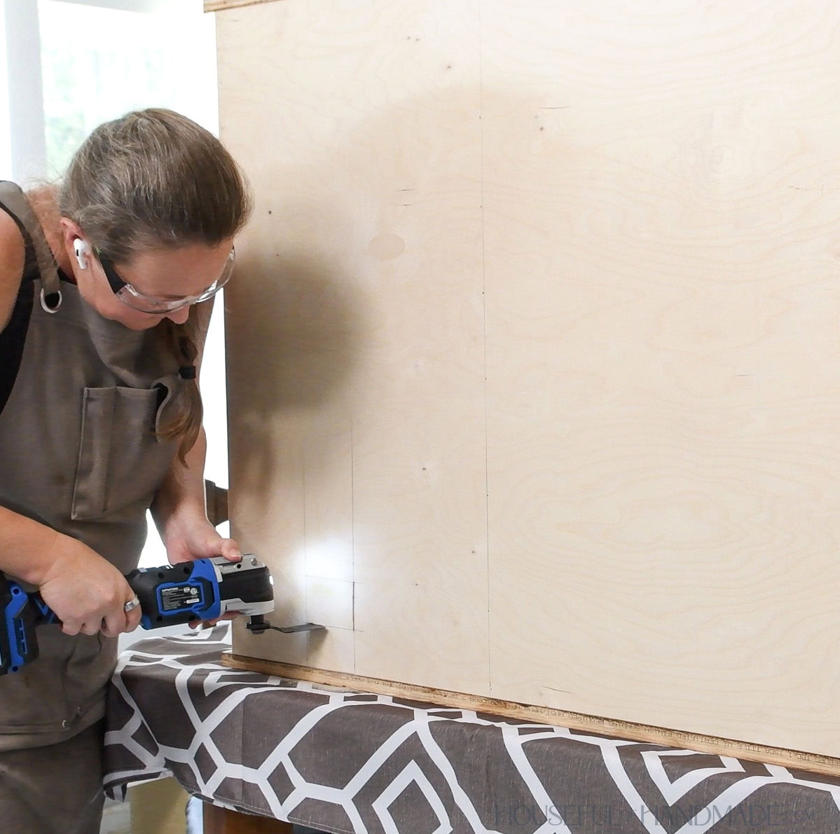 Making an outlet opening in the cabinet back. 