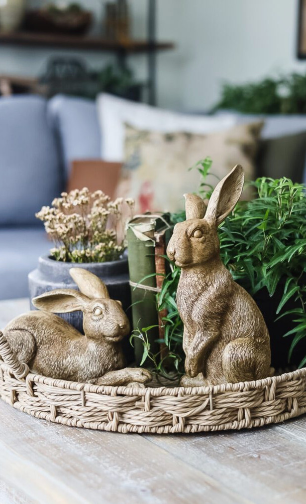 tray display for spring with bunnies, ivy, books, and flowers