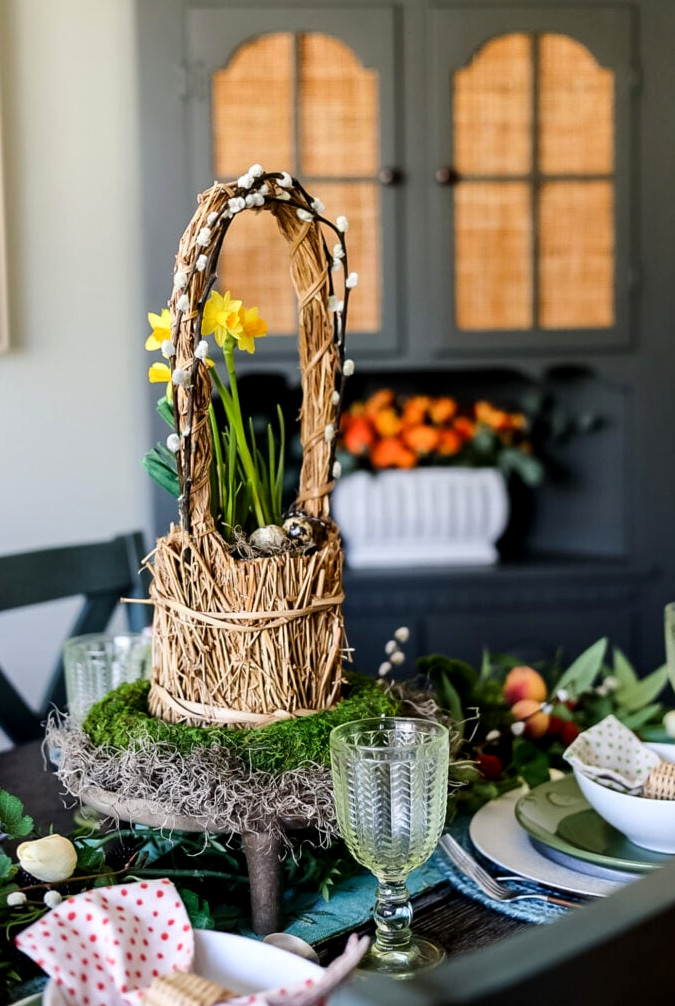 table centerpiece for spring in straw handled basket with daffodils