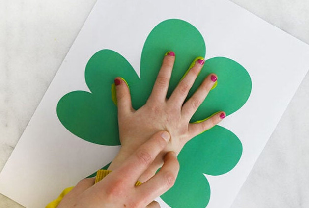 Hand stamping shamrock paper