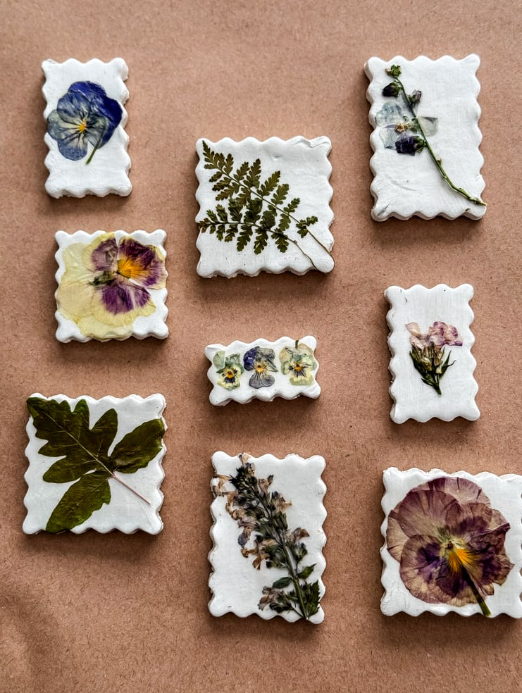 pressed flower magnets shaped like postage stamps