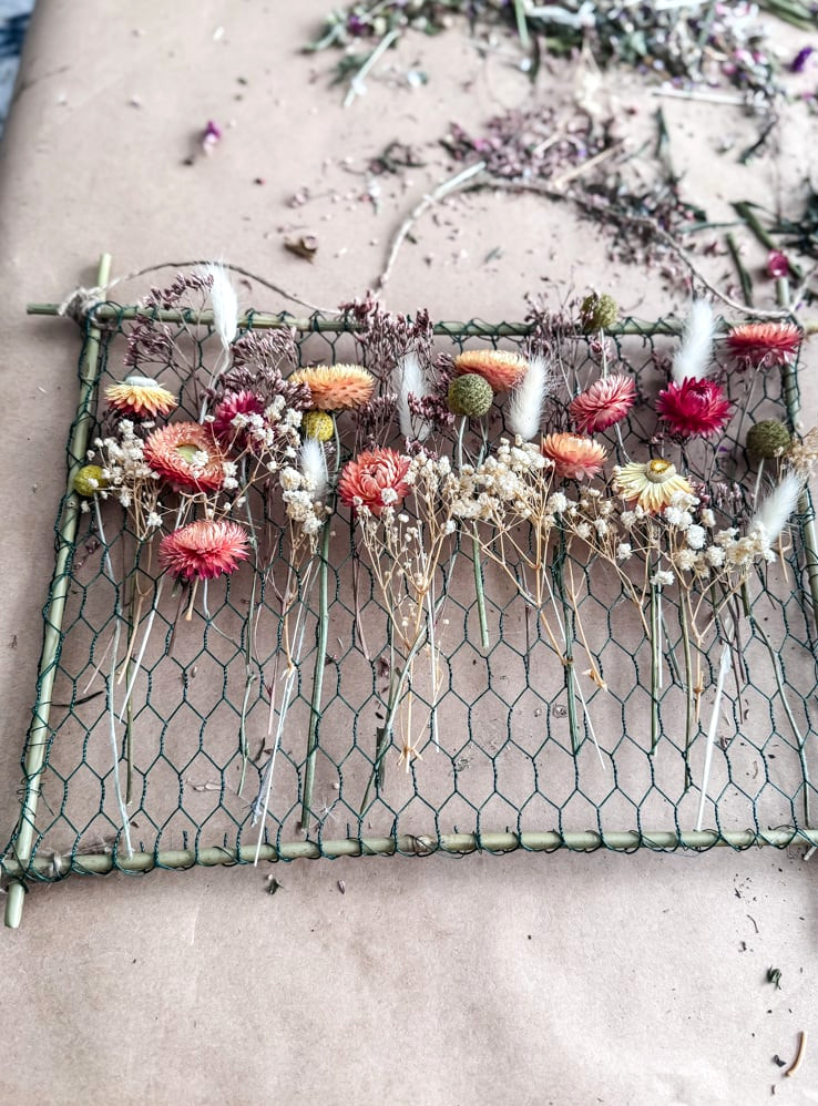 dried blossoms on a chicken wire frame