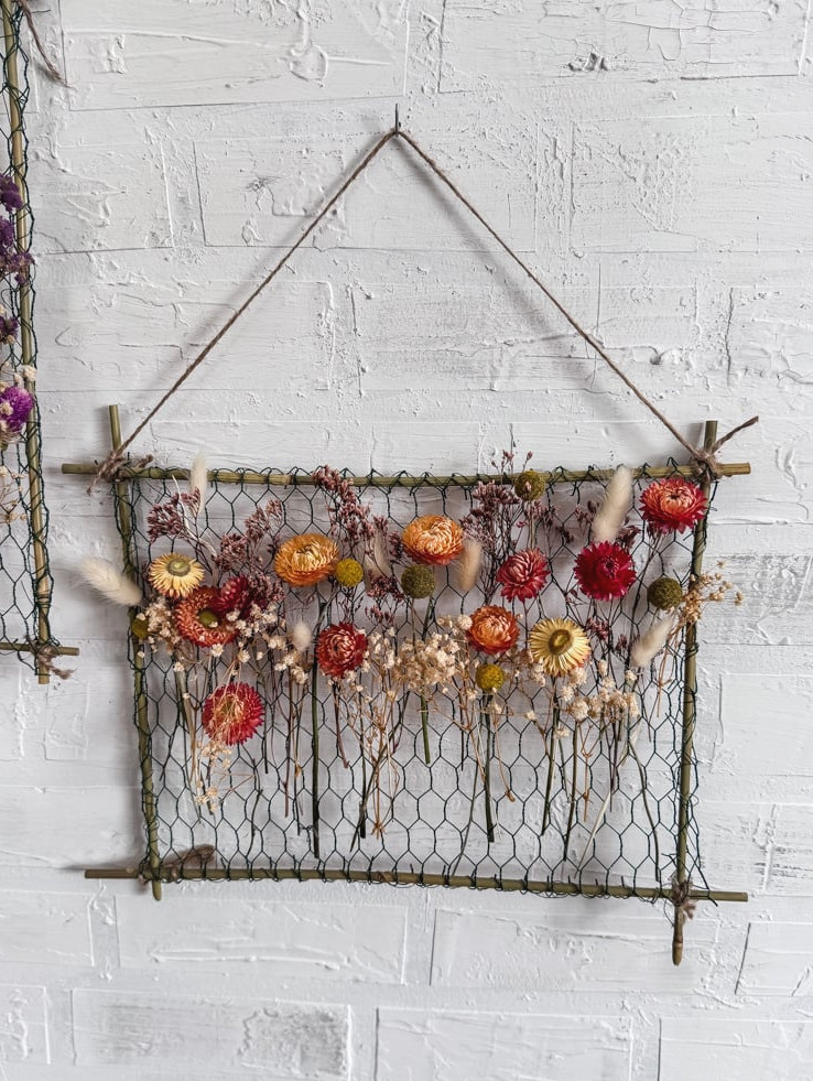 orange dried flowers in a hanging frame