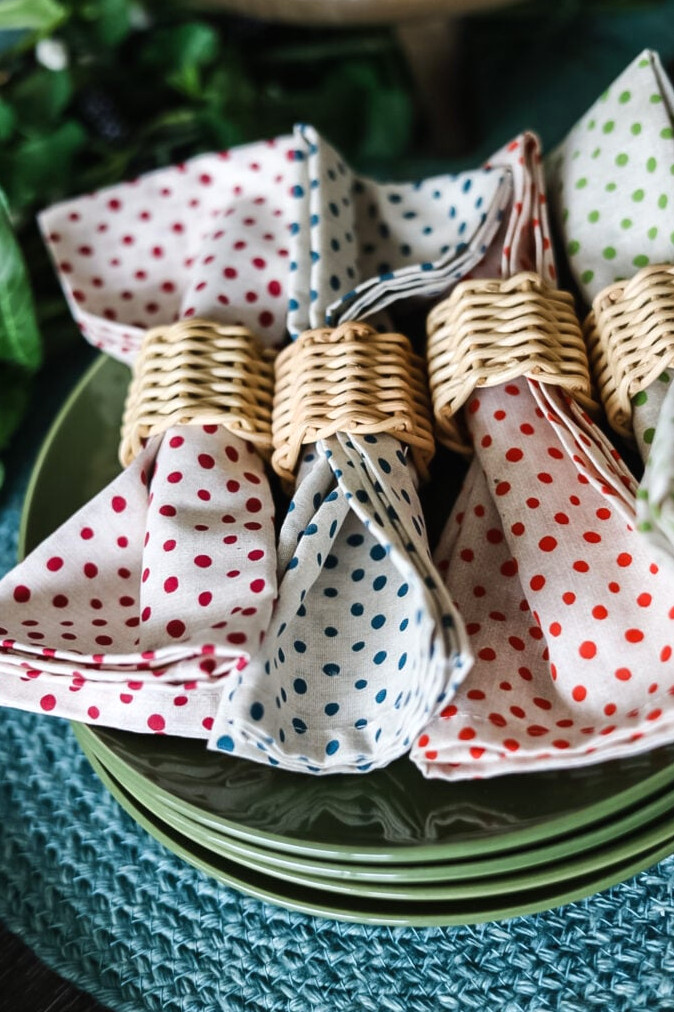 assorted colorful polka dot napkins with rattan napkin rings